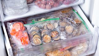 Bags of frozen food in freezer