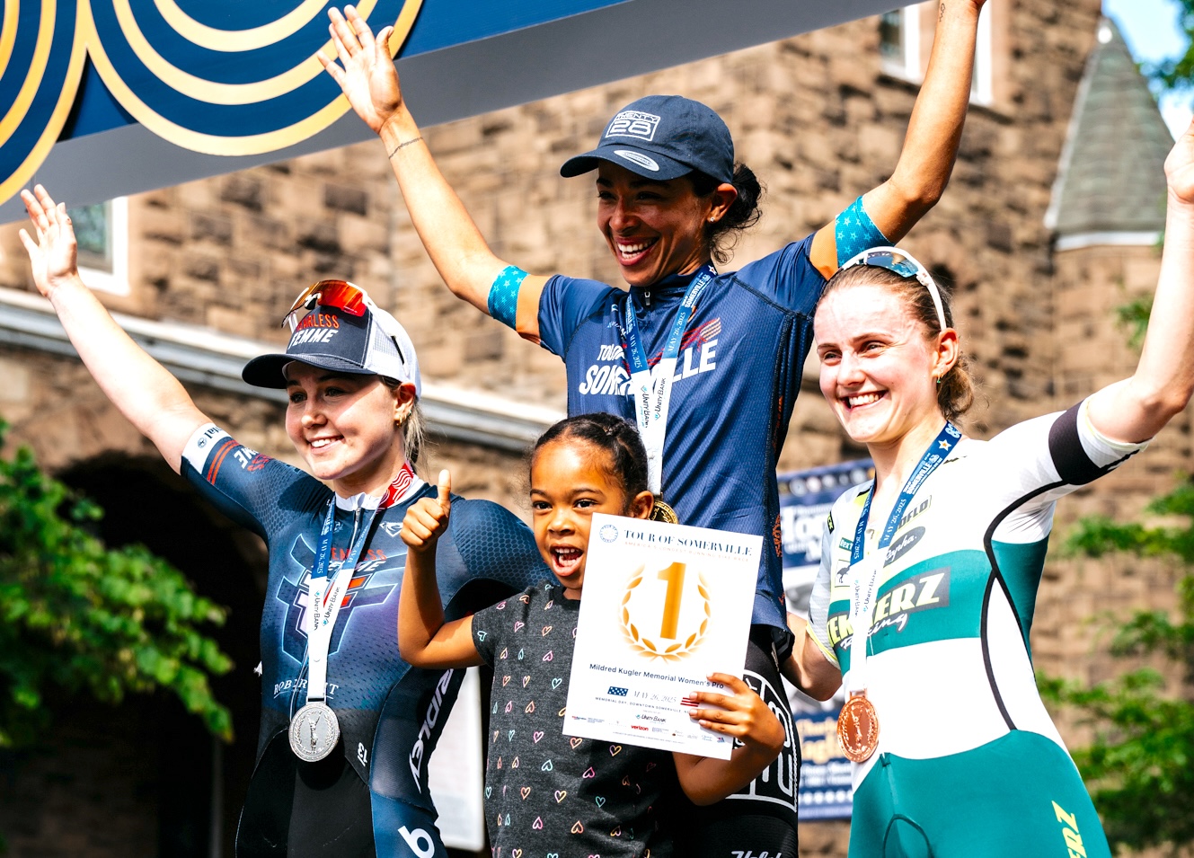 The women's podium of Tour of Somerville, with winner Marlies Mejias sharing the top step with five-year-old daughter Marieth