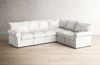 A white farmhouse-style sectional sofa