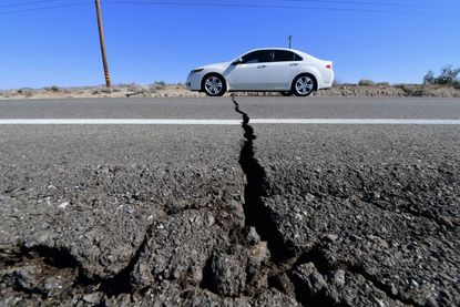 A crack in a California road caused by an earthquake.