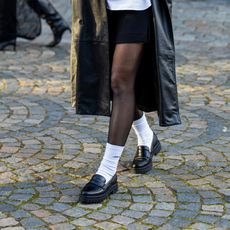 woman wearing loafers and socks