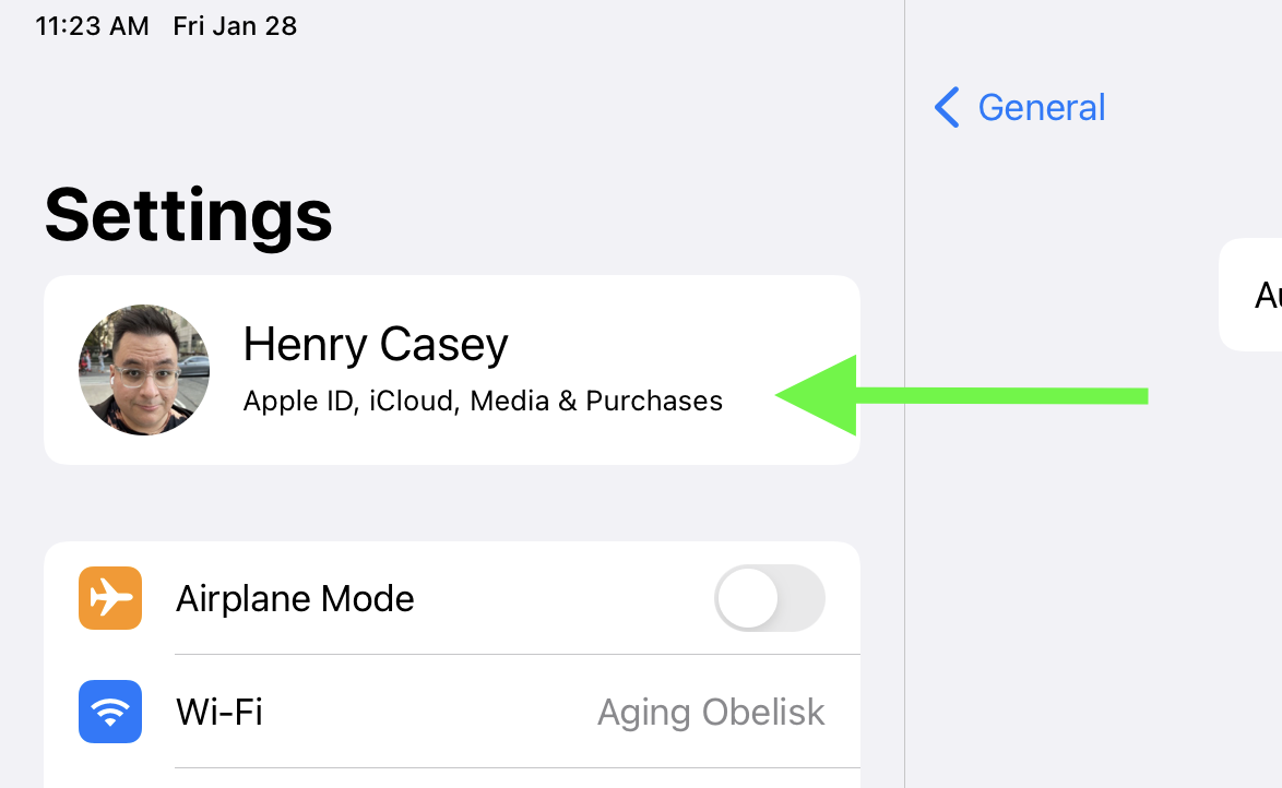 A iPadOS system preferences window with the user's Apple ID highlighted