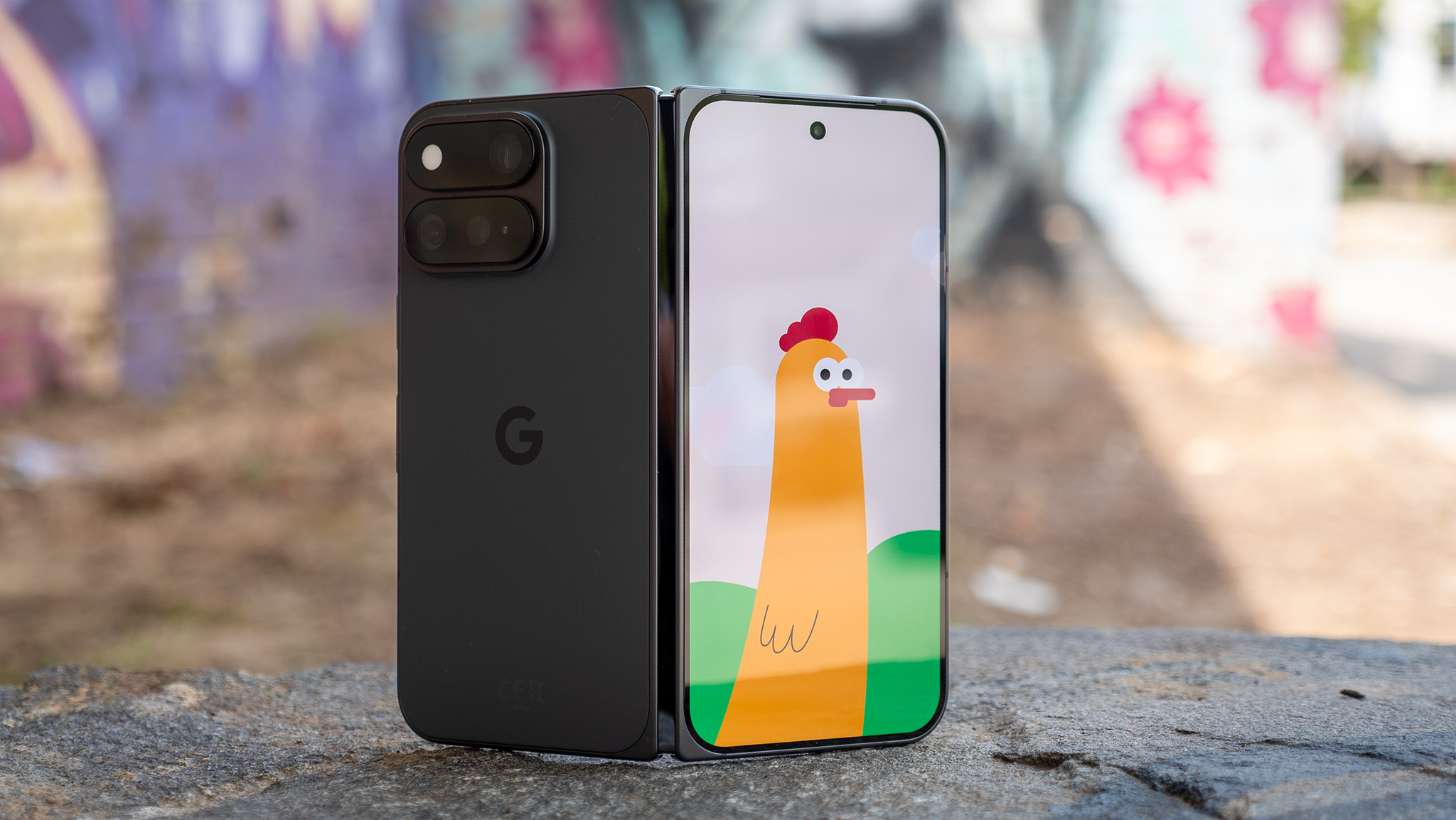 The Made You Look feature on a Google Pixel 11 Pro Fold showing an animated chicken on the front screen