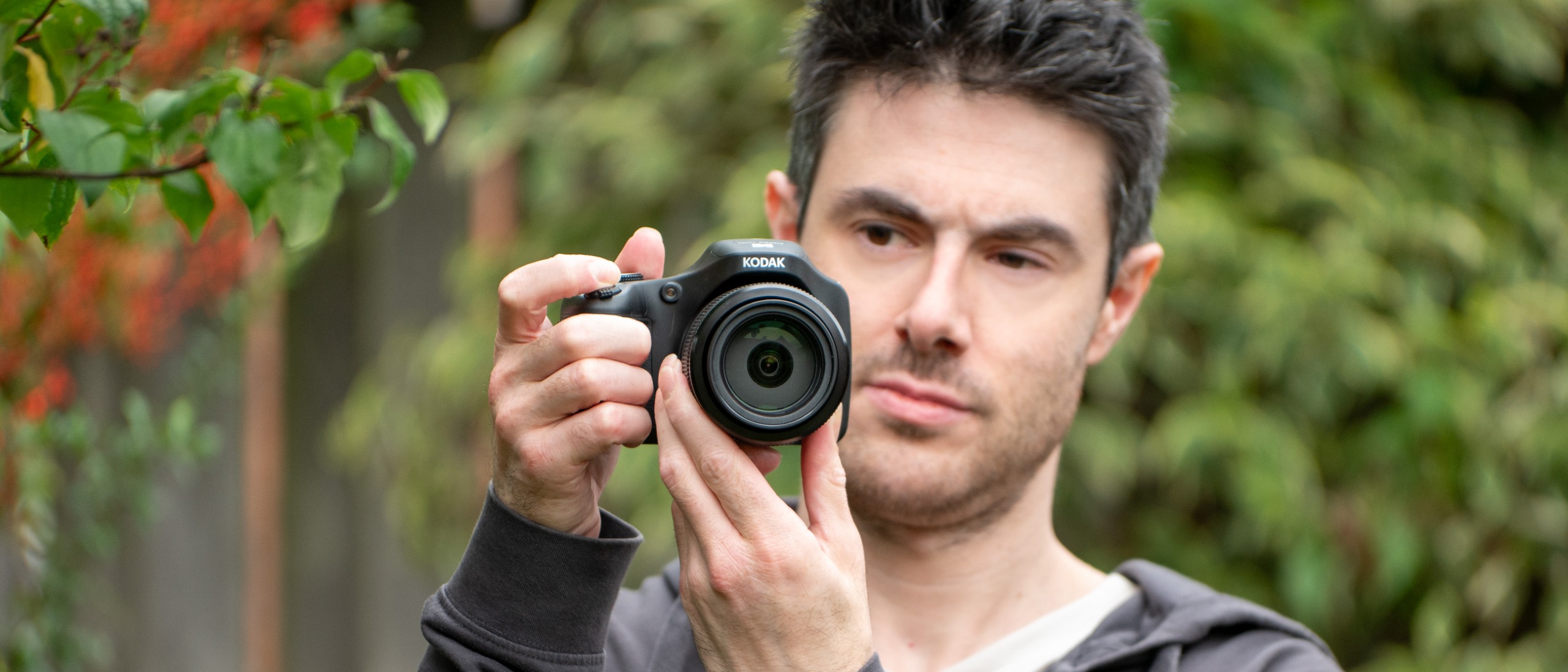 A man with the Kodak Pixpro AZ653 bridge camera