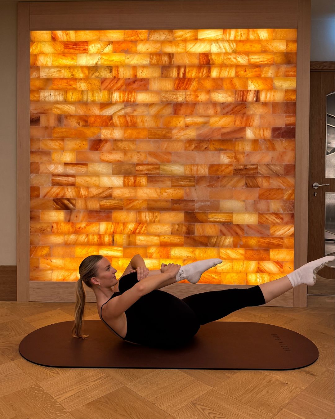 Single Leg Stretch: Pilates instructor and MC UK Master Ashlea McKee demonstrating the best Pilates moves for runners