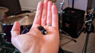 Earplugs being tested at a loud band rehearsal