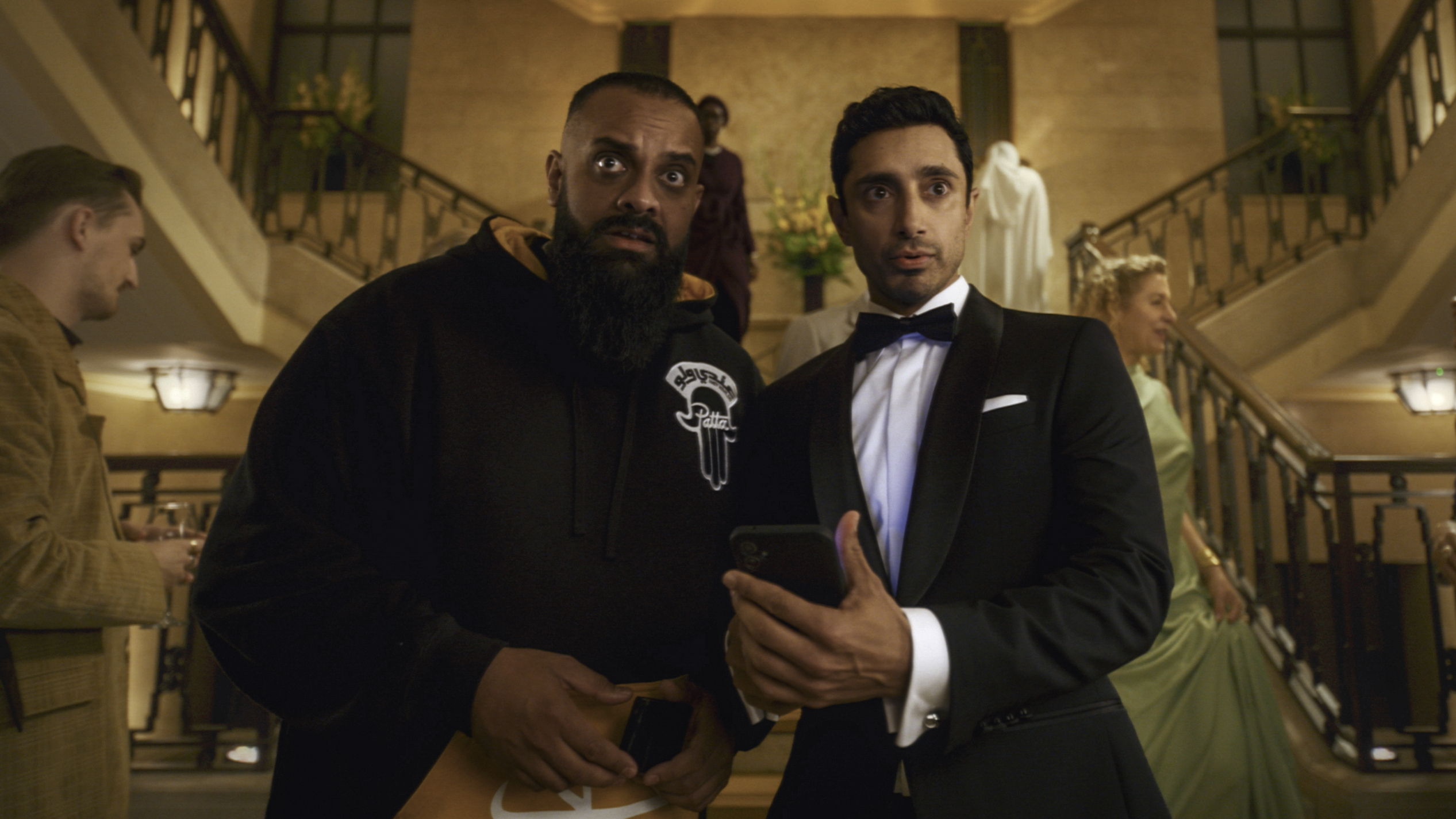 L-R: Guz Khan and Riz Ahmed at a gala event in a scene from Prime Video's "Bait"