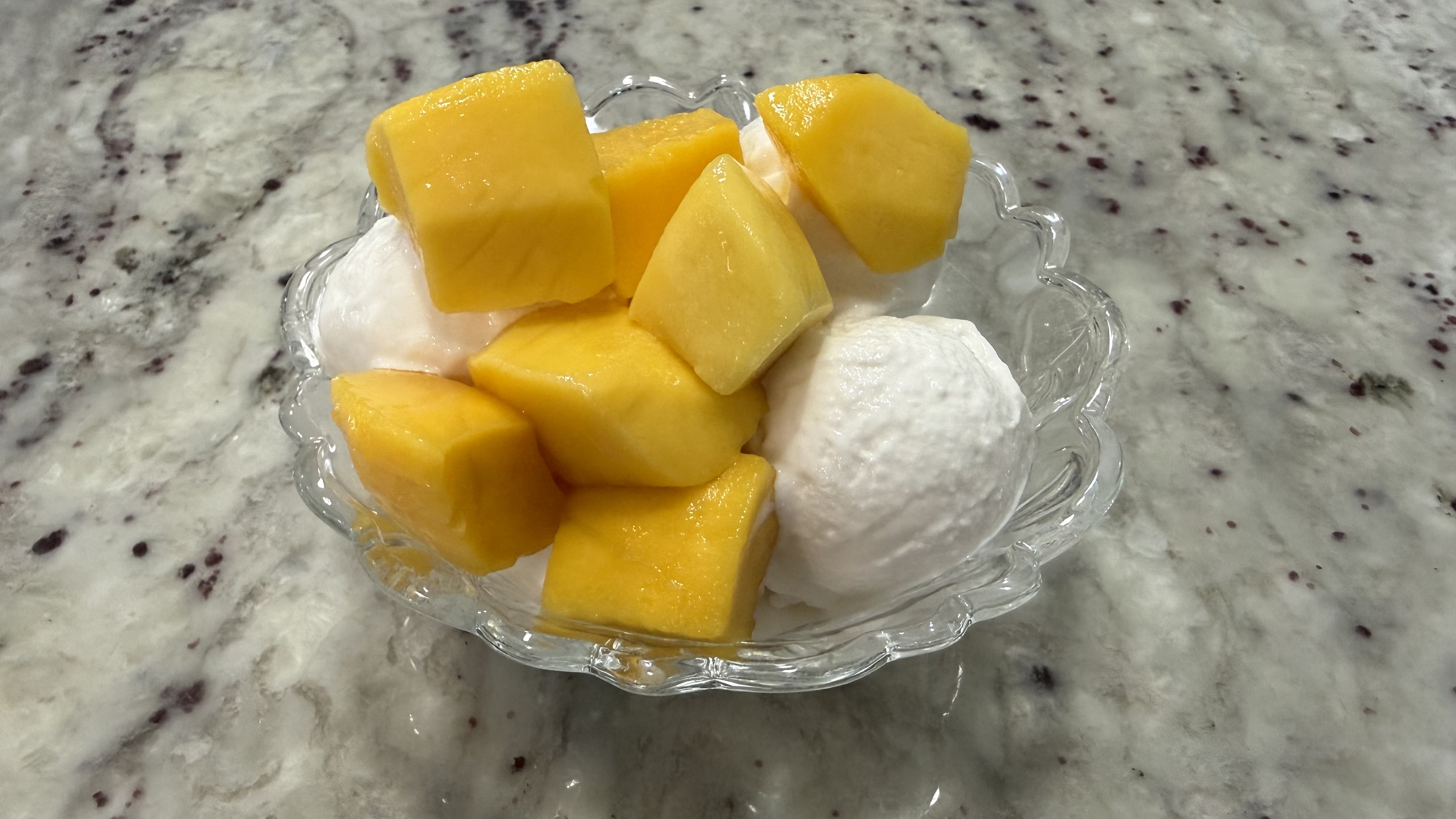 Ninja Creami vanilla ice cream with mangoes
