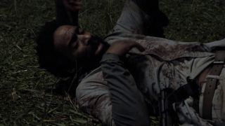 kevin carroll's virgil lying on ground after being stabbed in the walking dead season 11