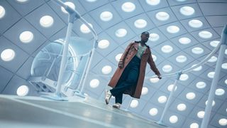 A tilted press image of Ncuti Gatwa's 15th Doctor standing in the TARDIS in Doctor Who season 14