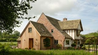 oak frame home with handmade clay tile roof