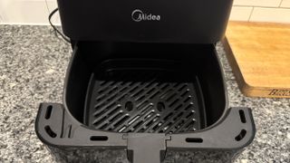 Midea MAD53109APK 5.5QT Air Fryer drawer open on writer's counter in kitchen