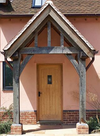 classic gable-fronted oak frame porch on posts