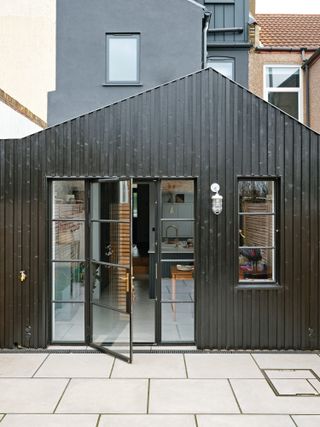 Rear extension with charred wood cladding and Crittall-style doors