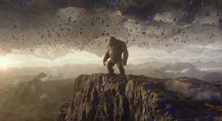 Kong stands on a cliff in the Hollow Earth in Godzilla vs. Kong.