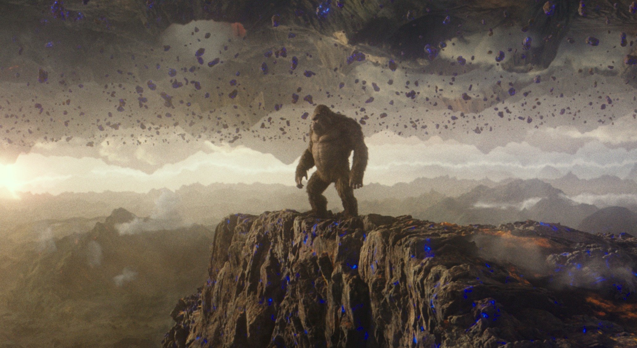 Kong stands on a cliff in the Hollow Earth in Godzilla vs. Kong.