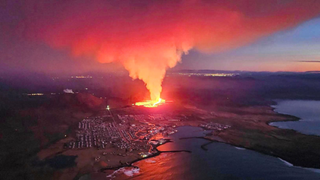Billowing smoke and lava seen from this aerial shot over Grindavik