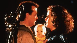 Bill Murray and Sigourney Weaver standing together with a baby in Ghostbusters II.