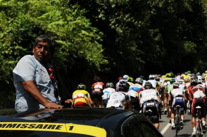 Ibrahim Omar, Chief Commissaire from Malaysia, keeps an eye on the peloton