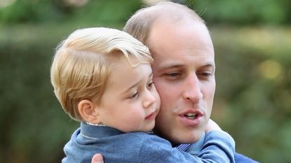 Prince George of Cambridge with Prince William, Duke of Cambridge at a children's party for Military families during the Royal Tour of Canada on September 29, 2016