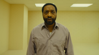 Actor Chiwetel Ejiofor walking through the backrooms.