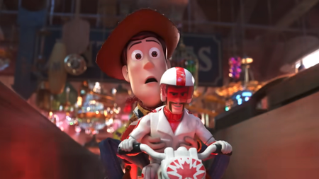 Woody and Duke Caboom on a motorcycle in Toy Story 4