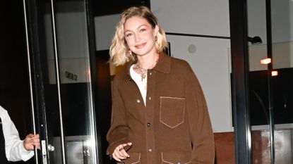 gigi hadid wearing a chocolate brown jacket 