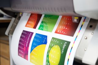 Color prints coming out of printer