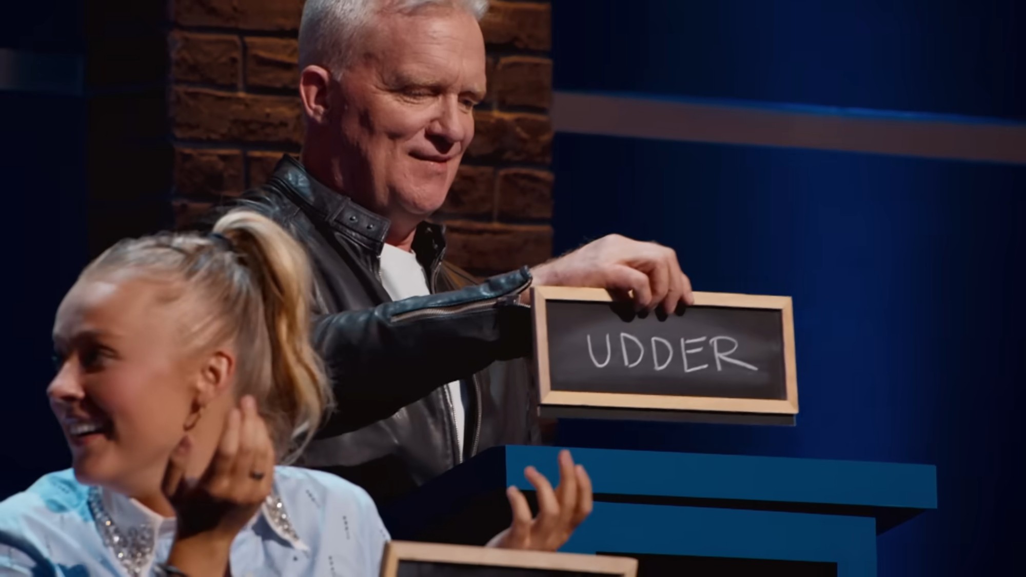 Jojo Siwa and Anthony Michael Hall answering questions in Nation's Dumbest.