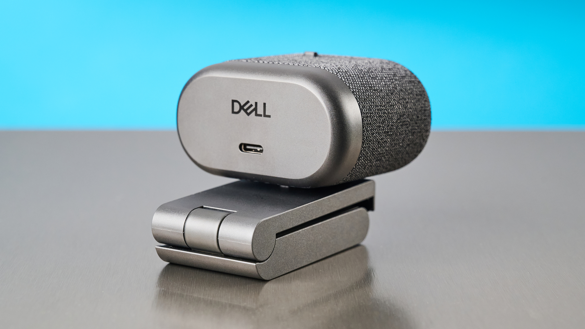 Dell Pro 7 Webcam photographed in front of a blue background