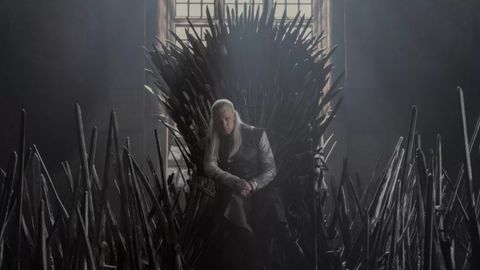 House of the Dragon actor Matt Smith (Daemon Targaryen) sits on the Iron Throne