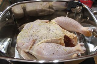 A whole chicken ready to be cooked in the Wolf Gourmet Multi-Function Cooker