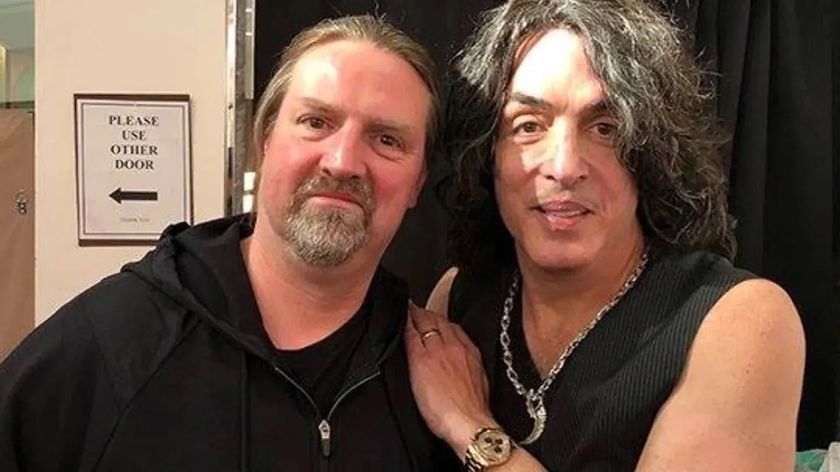 Karl Cochran standing next to Paul Stanley