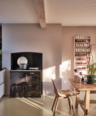 dining room with light lilac walls and wooden furniture