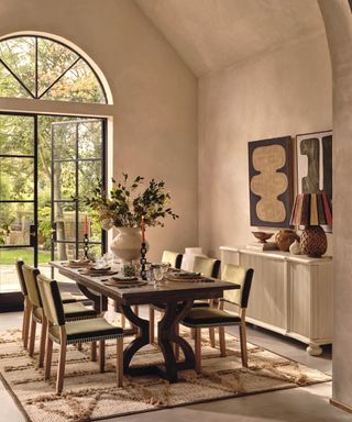 modern dining room with a large dark wood dining table and textured neutral rug