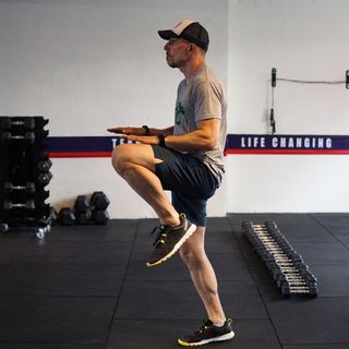 Man demonstrates high knees exercise