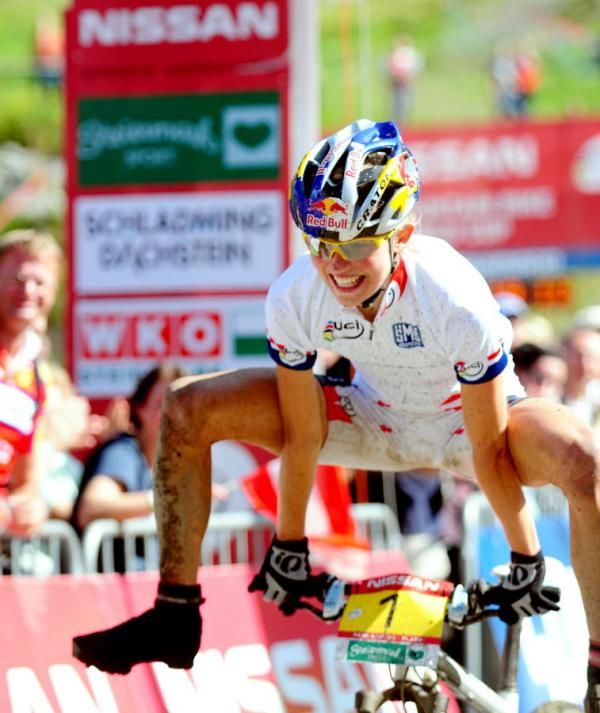 Elisabeth Osl (Central Ghost) leapfrogs her handlebars at the finish!