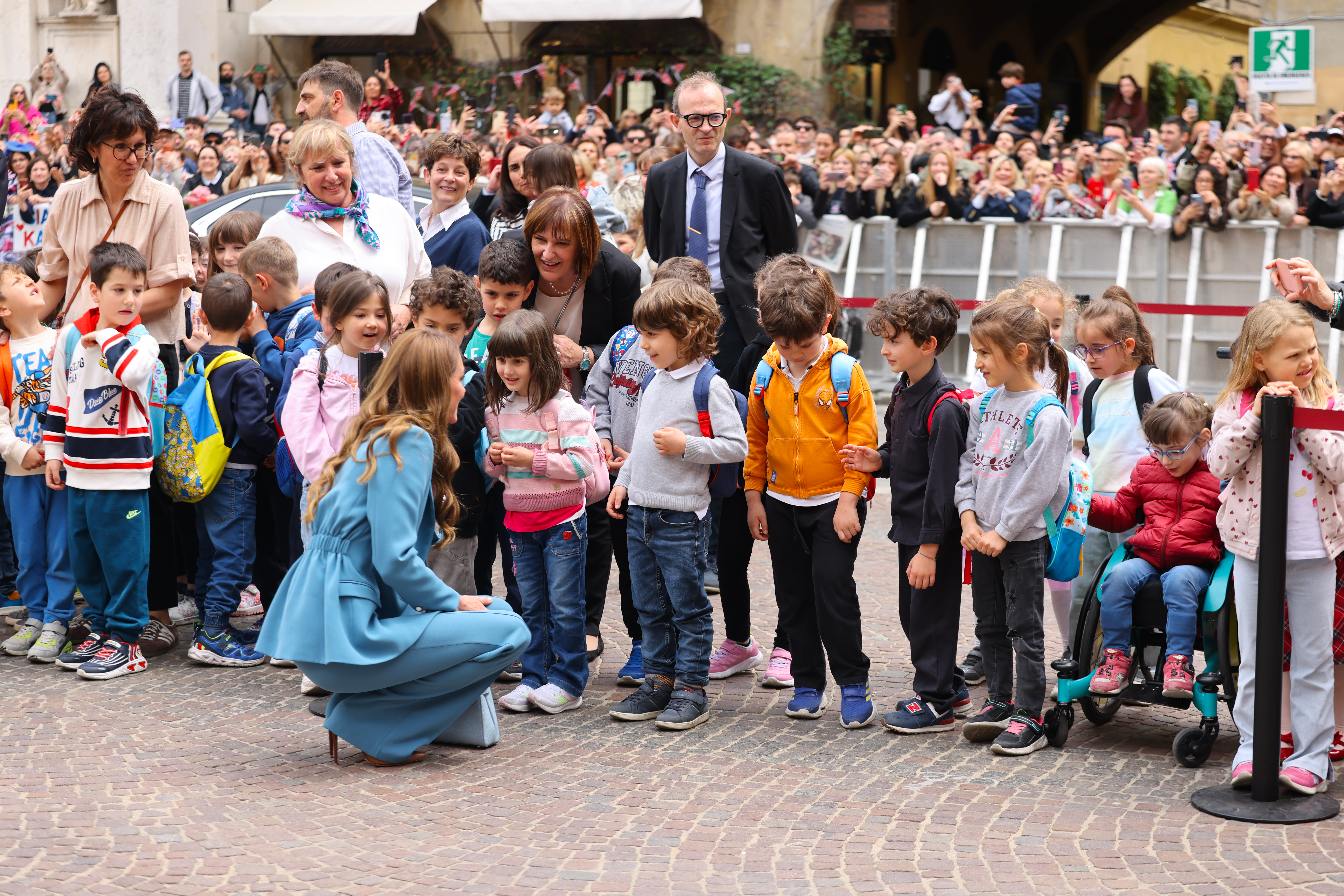 Catherine, Princess of Wales, speaks to children as she arrives at the city hall on the first day of her visit to Reggio Emilia on May 13, 2026 (Photo by Robino Salvatore/GC Images)