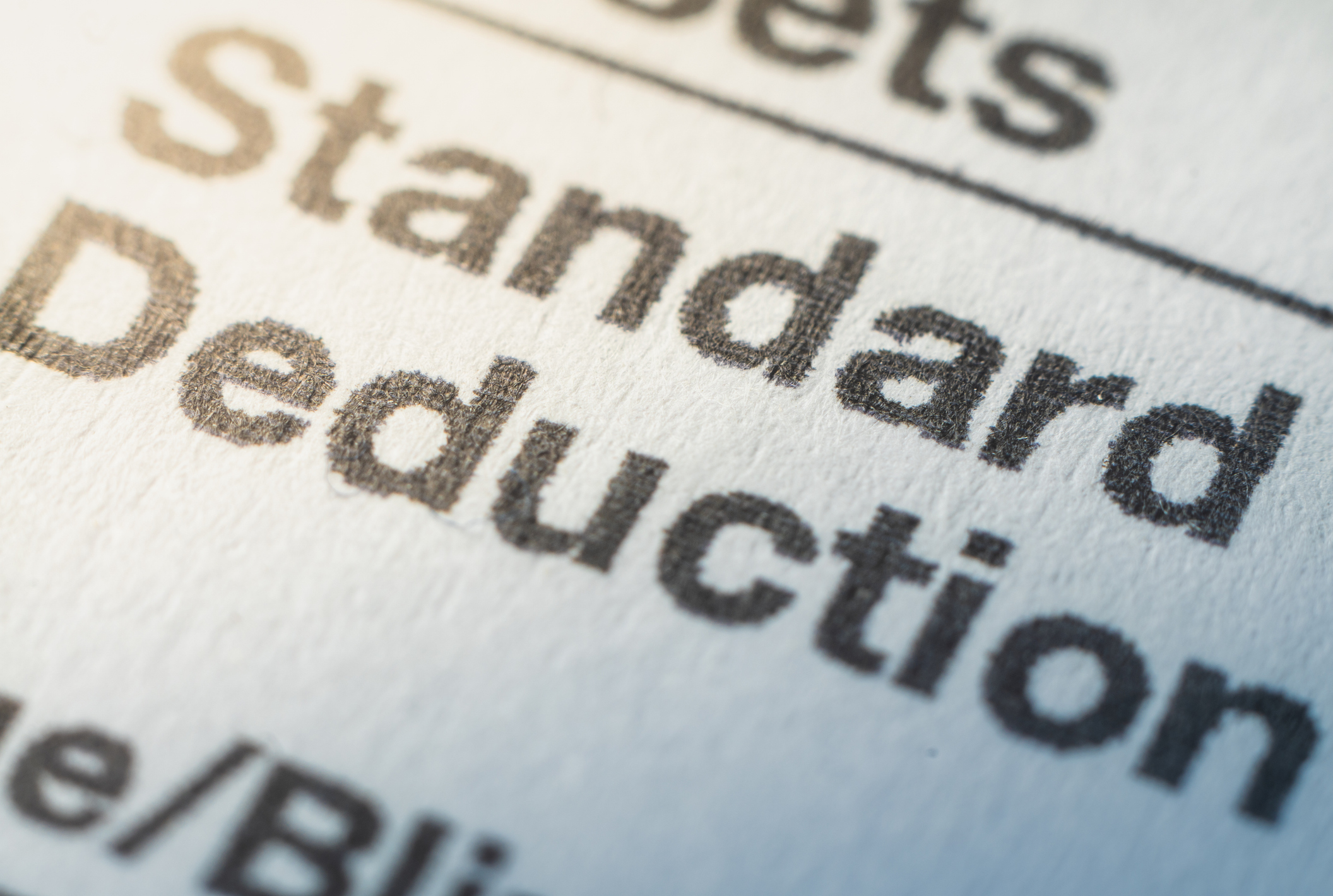 the words "standard deduction" printed on paper