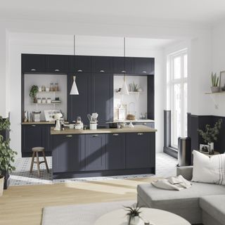 dark blue kitchen with island open plan to seating area