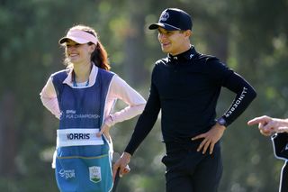 Lando Norris chats to his caddie during the BMW PGA Championship Pro-Am