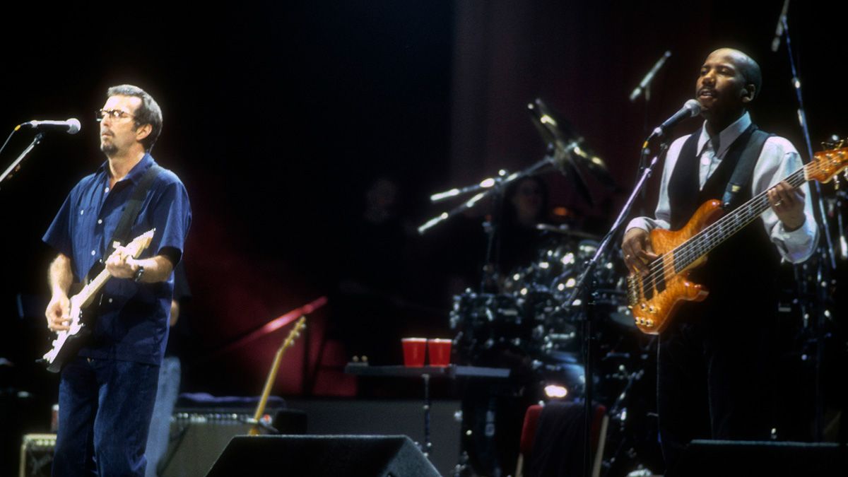 Eric Clapton performs with bassist Nathan East at Madison Square Garden on April 19, 1998 in New York City