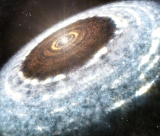 An artist's illustration shows the water snow line spotted around the young star V883 Orionis. In a new study, researchers have discovered ice fossils in an ancient meteorite which shows how objects that formed with ice beyond the snow line in the early solar system moved towards the sun (leaving behind these porous "fossils"). 