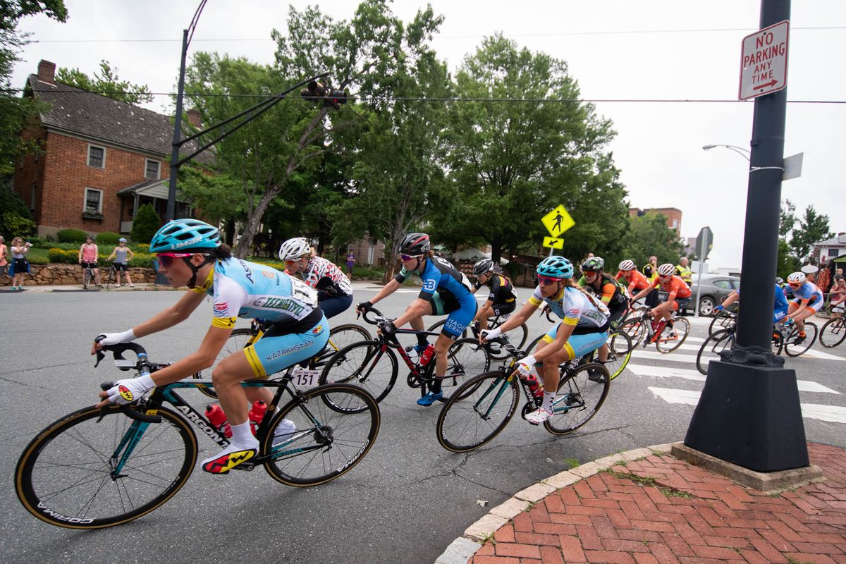 The women's peloton takes a corner during the road race at the Winston-Salem Cycling Classic