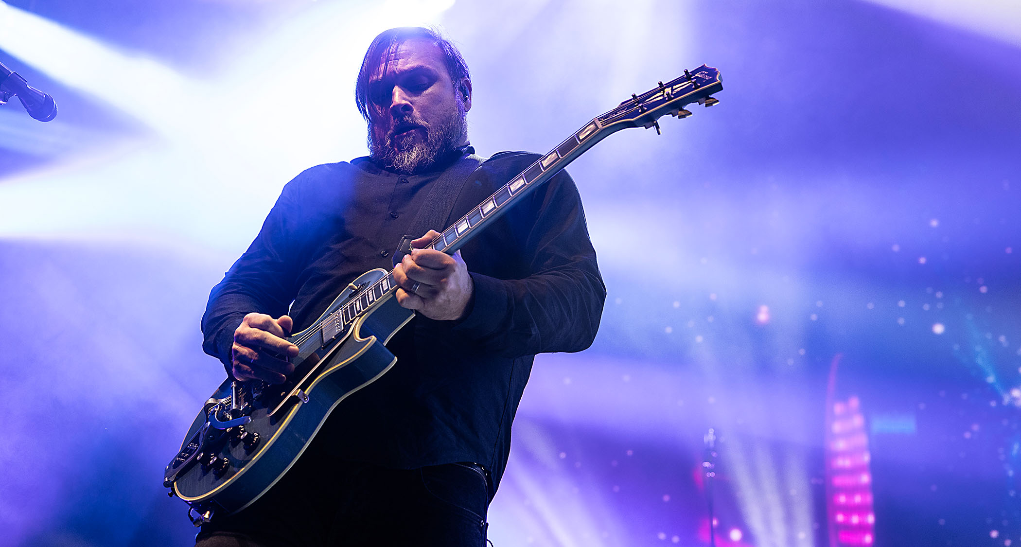 Travis Stever of Coheed and Cambria performs at PNC Music Pavilion, playing his Gibson Les Paul