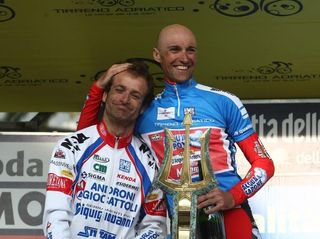 Garzelli consoles his rival Scarponi on the podium.