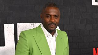 Idris Elba at the premiere of "Luther: The Fallen Sun"wearing lime green jacket