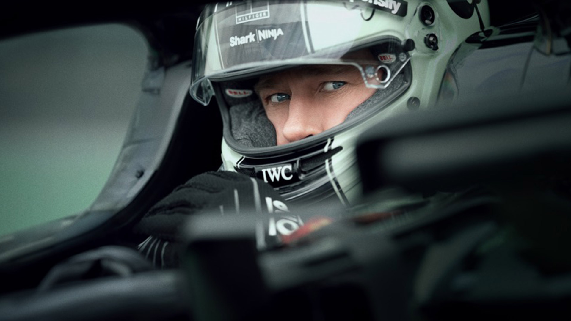 Brad Pitt wears a helmet in an F1 car