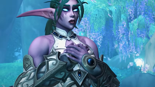 Tyrande stands in front of the Night Elf's new home, Amirdrassil, in World of Warcraft: Dragonflight. She is a powerful Night Elven Warrior among lush blue forestation.