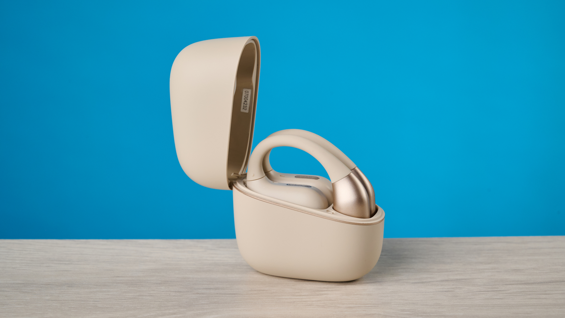 Panasonic RB-F10 in beige photographed in front of a blue background